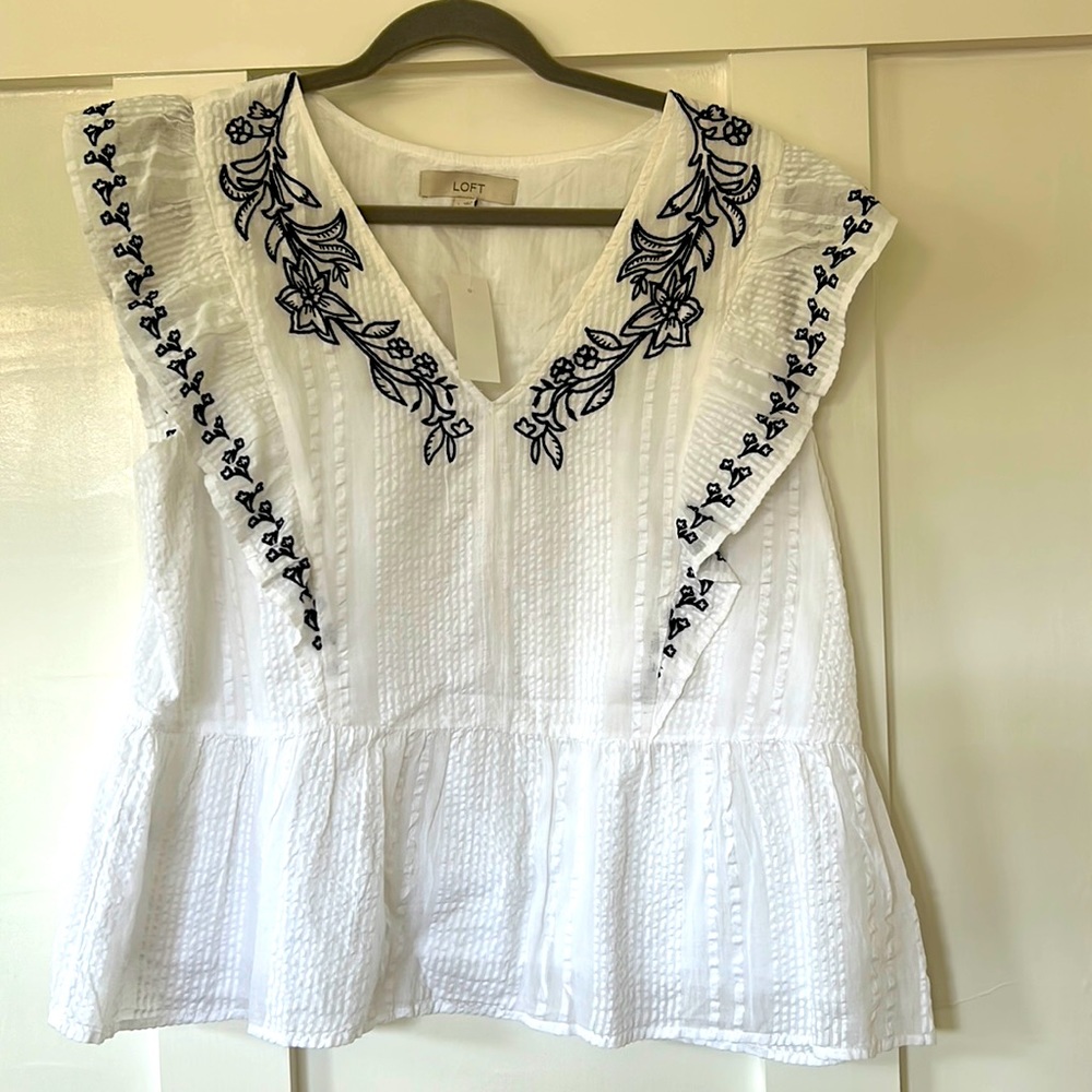 NWT Loft size large flutter sleeve blouse. White with black embroidered pattern.